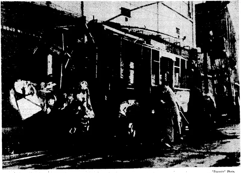 Ghastly, scenes were .witnessed on October 14 when Japanese aeroplanes bombed the Chinese quarters alongside Soochowr Creek, one of the bombs falling inside the Settlement and ivrecking a trackless tram and killing and wounding the occupants. The photograph shows[the wreckage glihe tram-car a[ter the bombing,,_ (Evening Post, 20 November 1937)