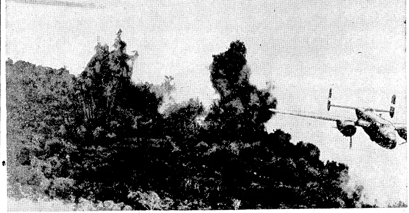 A Mitchell medium bomber of the Fifth United States Army Air Force heads for its base after dropping its bomb load on Japanese positions at Cape Gloucester, Neiv Britain Island, prior to landing operations by the marines. (Evening Post, 29 February 1944)