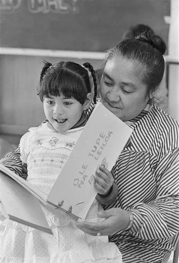 Image: Samoan playschools administrator Fereni Ete, reading a story in Samoan to Fuatina Mapu at the Samoan A'oga Amata, (beginning school) at Strathmore Park School, Wellington - Photograph taken by Martin Hunter