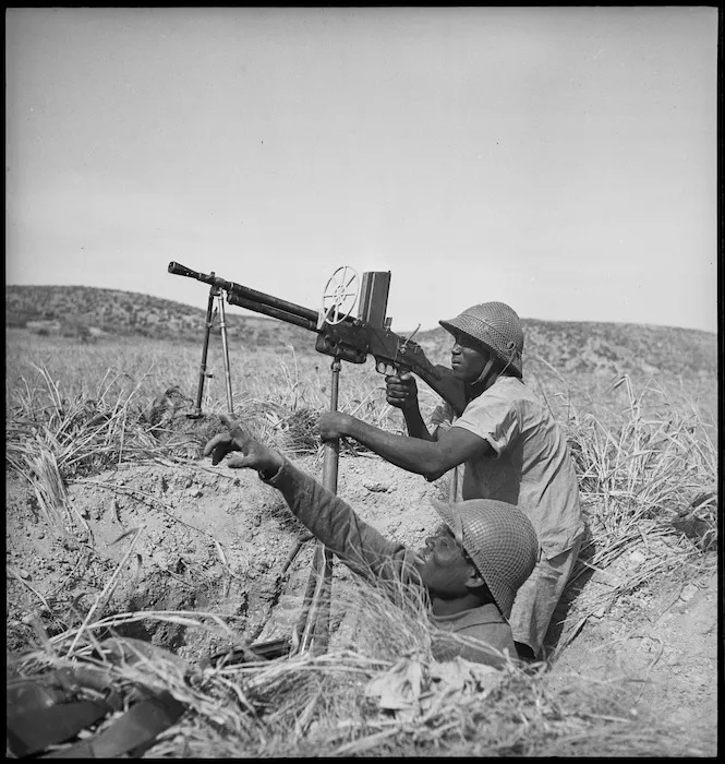 Senegalese troops with Free French forces operating machine gun in Tunisia, World War II - Photograph taken by M D Elias