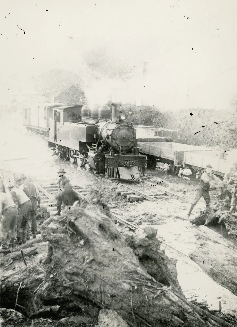 Summit station yard; clearing debris from the tracks. Five men visible.