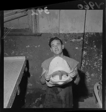 Image: An unidentified man with the head of a large shark at the Fishermans Co- Op Building, Wellington City