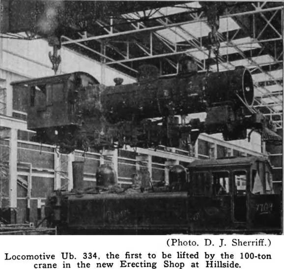 (Photo. D. J. Sherriff.) — Locomotive Ub. 334, the first to be lifted by the 100-ton crane in the new Erecting Shop at Hillside