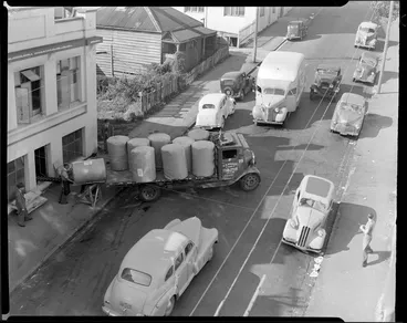 Image: Unloading bales from truck, location unidentified