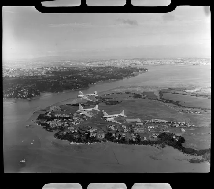 RNZAF (Royal New Zealand Air Force) Squadron 41, flying DC4 airplanes over Hobsonville aerodrome, Auckland