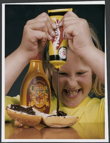 Image: Tamsyn Clemerson trying squeeze packs of Vegemite and golden syrup - Photograph taken by Ross Giblin