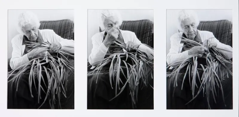 Rangimarie Hetet weaving a kete at her home in Te Kuiti