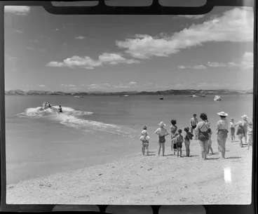 Image: People watching a water skier at Maraetai beach, Auckland