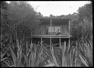 Image: Hans Peter Knutzen sitting on the verandah of his home, Piha