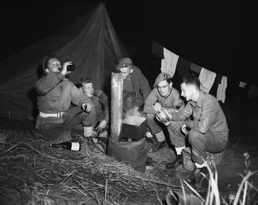 Image: New Zealand gunner sitting around a space heater, Korea