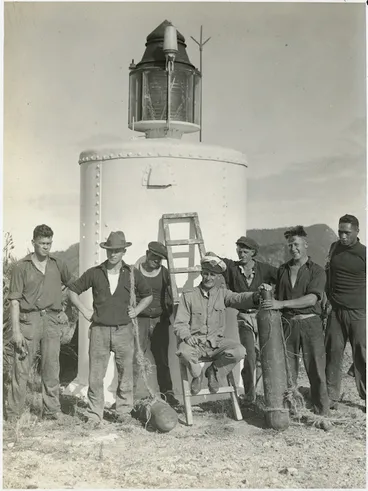 Image: Men alongside a lighthouse on one of the Chickens Islands - Photograph taken for the Auckland Weekly News