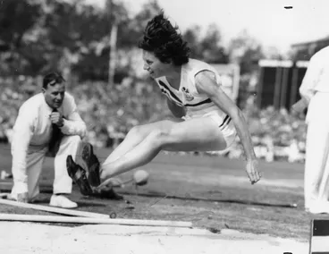 Image: Yvette Williams long jumping at Carisbrook Park, Dunedin