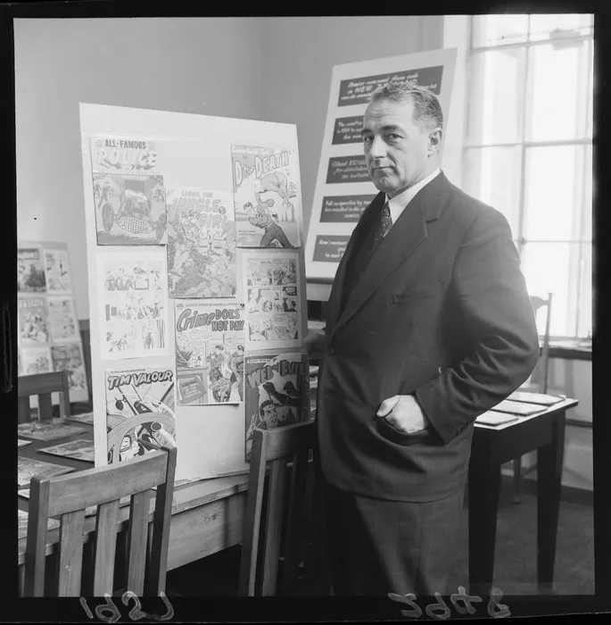 Minister Jack Marshall with a display of disapproved-of comics allegedly corrupting youth.