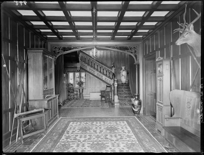 House interior in William Morris 'arts and crafts' style, with Japanese vases and gun cabinet etc