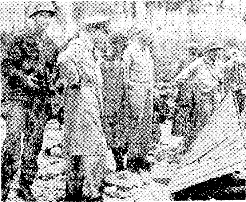 General Douglas Mac Arthur (second from left), accompanied by members of the Allied invasion forces, examines damage done to the Japane.se positions on Los Negros Island, in the Admiralty group,-ky: the naval, and air•■bombardment before the invasion by •' y the'-United Slates First ■ Cavalry Division, ■'■, (Evening Post, 14 March 1944)