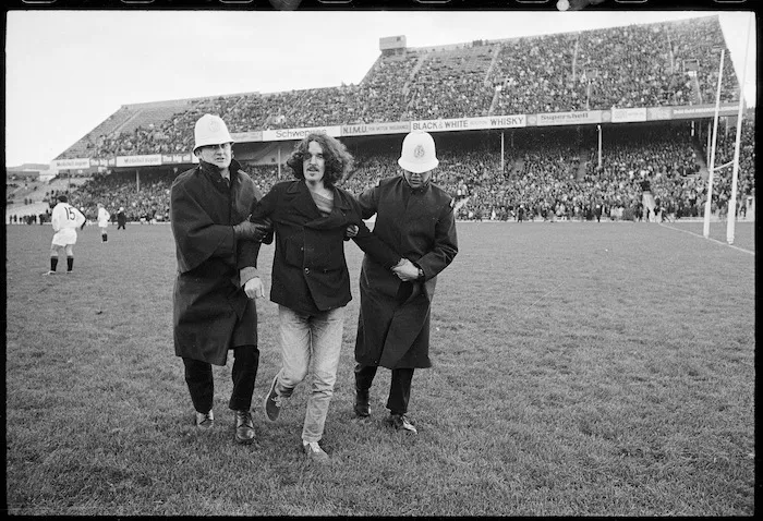Police apprehend an anti-apartheid demonstrator on Athletic Park