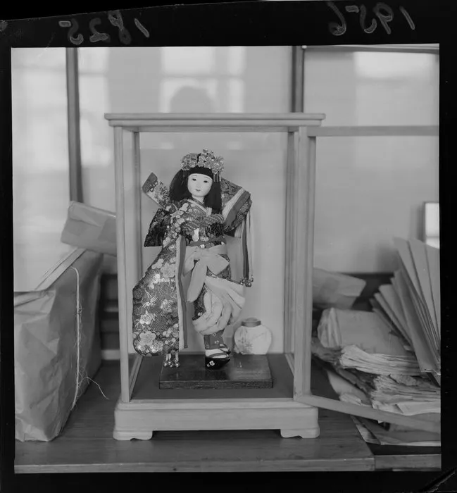 Japanese doll in a glass cabinet