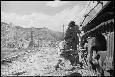 Image: NZ tank recovery men salvaging a tank in Cassino, Italy, World War II - Photograph taken by George Kaye