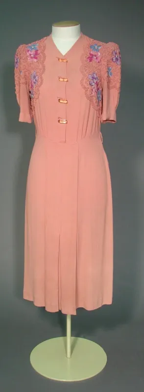 Day dress; pink fabric with floral details and braiding