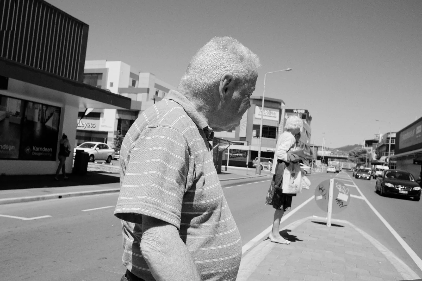 Pedestrians on Colombo Street traffic island