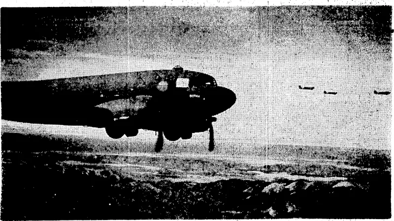 Allied transport planes flying across the mountains of New Guinea towards Wau. Quick cdndentralion of men and guns by air was responsible for the defeat of the Japanese attack on Wau.' (Evening Post, 22 March 1943)