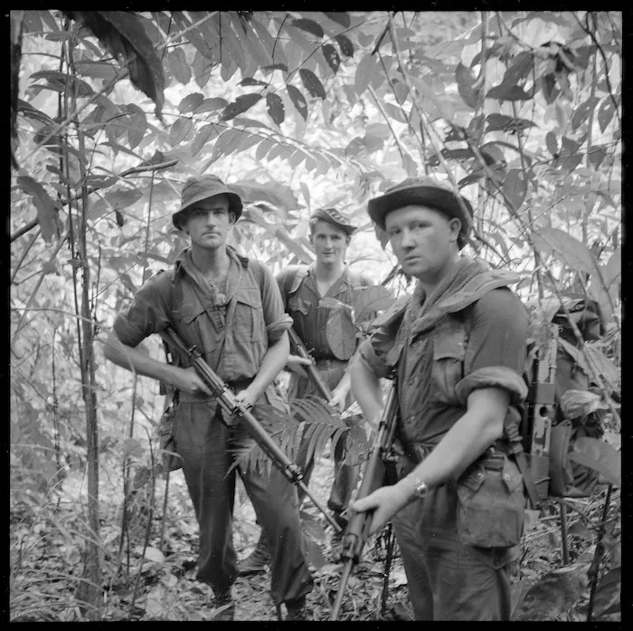 Privates T Farley, R A Smith and M J Pickworth of the New Zealand Regiment in the Malayan rain forest