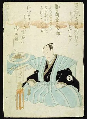Man seated by a small table