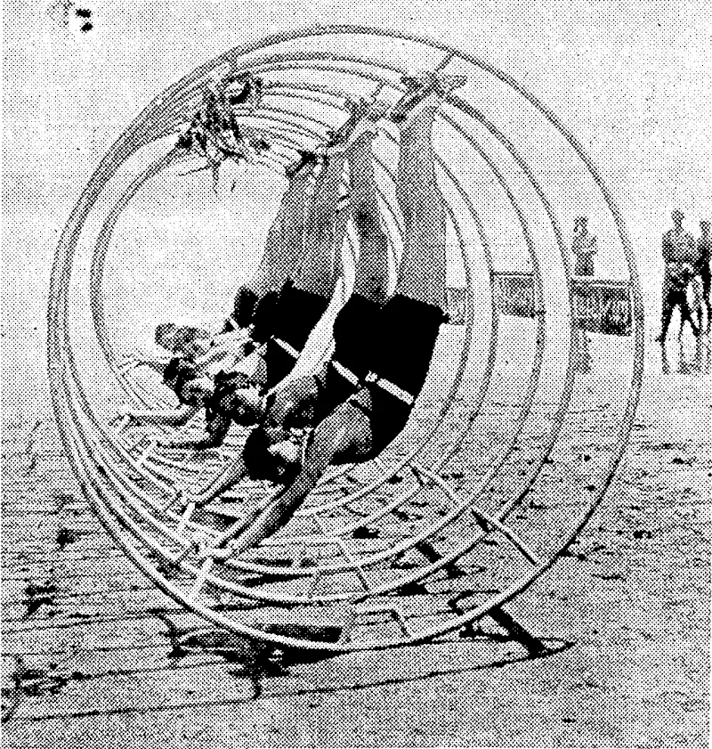 Sport and General" Photo. KEEPING FIT.—Gyro-wheels are becoming very popular on beaches-in Japan. The illustration shows bathing girls using the wheels on the ■ beach at Kamakura, near Tokio. (Evening Post, 27 September 1934)