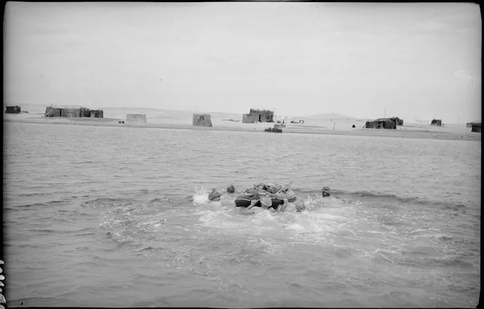 Army scouts crossing waterway pushing rubber inflatable boat, Canal Zone