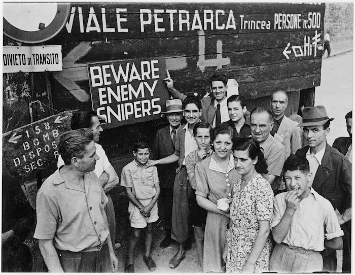 Civilians in the southern part of Florence grouped around warning signs erected by the Allies
