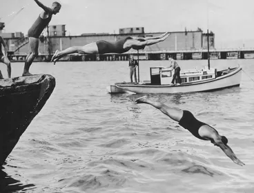 Image: Swimmers diving into Wellington Harbour at the start of the long distance handicap Peck Shield Harbour Race - Photographer unidentified