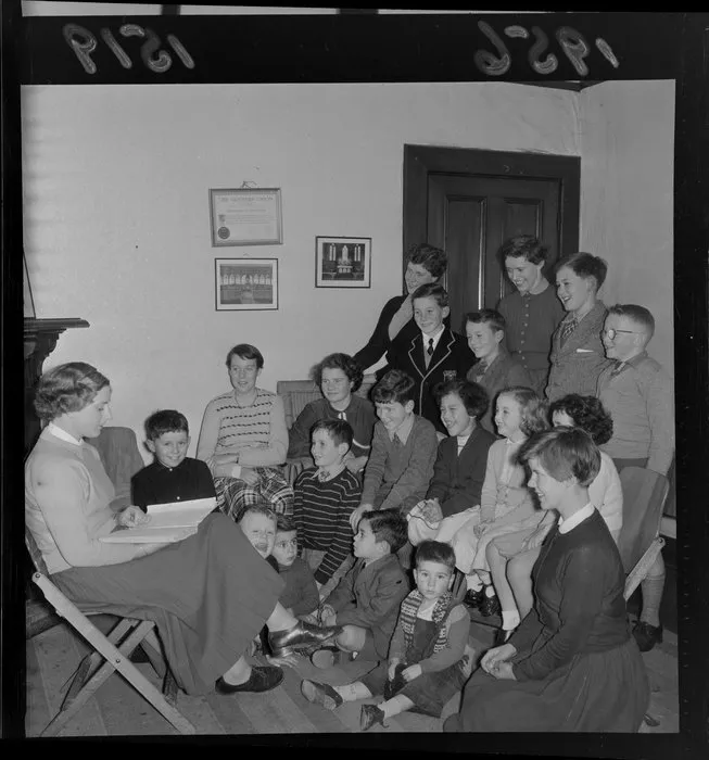 Children of all ages at creche listening to a story while their parents are at a St Paul's Cathedral dinner, Wellington