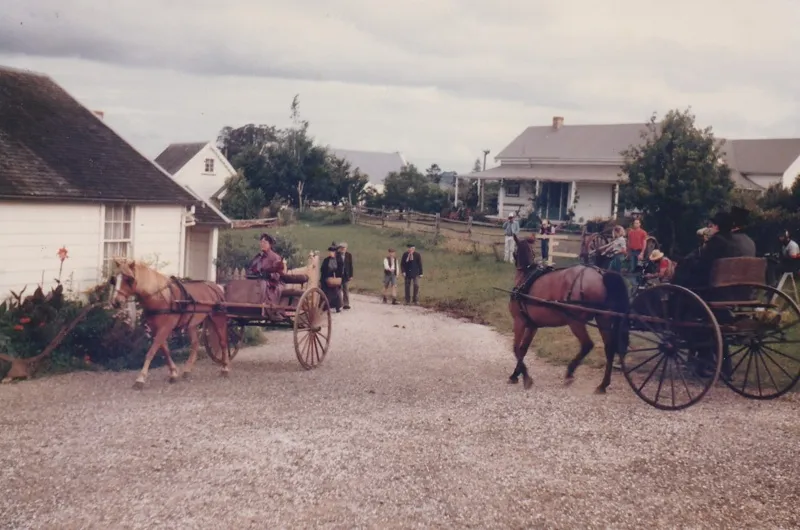 Filming on the set of 'Hanlon' in Howick Historical Village. Showing crew and cast, horses and wagons on Church Street, Briody-Gallagher Cottage, Sergeant Barry's and the Parsonage.