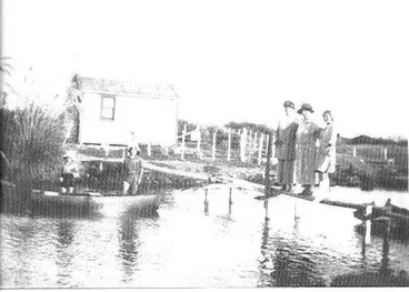 Image: Cottage & people beside Hokio Stream