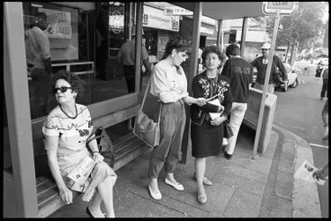 Image: Commuters at a bus stop, Queen Street, 1990