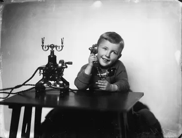 Image: Boy using a telephone