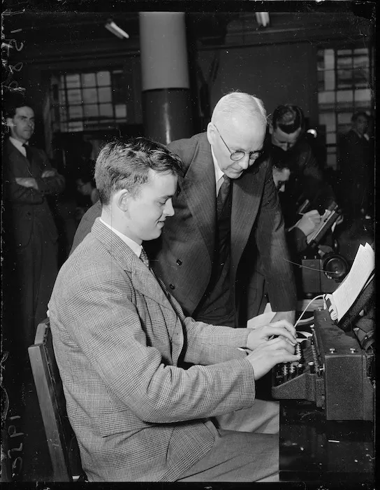 Man operating teleprinter machine at a post office