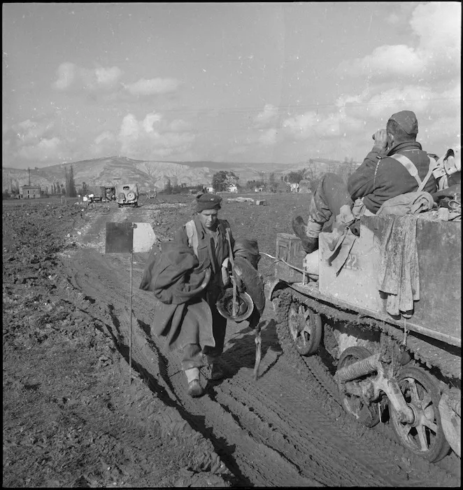 C J Cullen on his way out of the front line on Sangro River area passes bren carrier, Italy, World War II - Photograph taken by George Kaye