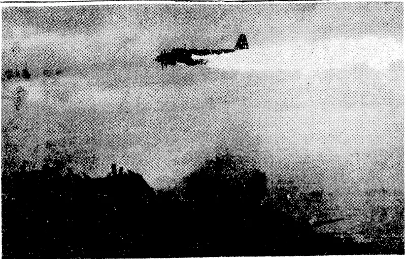 A blazing Japanese plane, hit by American anti-aircraft fire, passes over a United States navy escortcarrier as it dives towards the sea. (Evening Post, 04 June 1945)