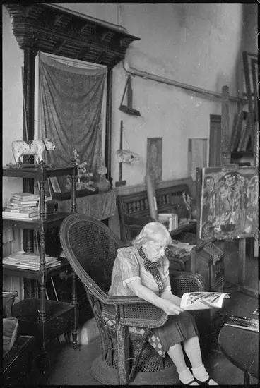 Image: Frances Hodgkins reading in her studio, Corfe Castle village, Dorset