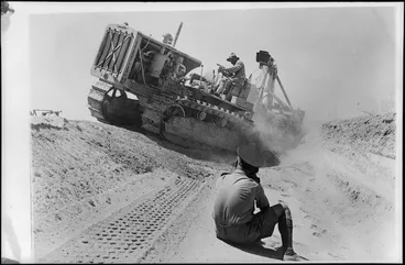 Image: World War 2 New Zealand engineers preparing a tank trap in the Western Desert, North Africa, using a caterpillar tractor