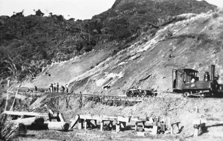 Piha Tramway engine by sand dune at mouth of Marawhara Stream.
