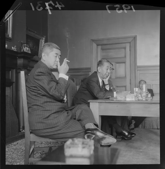 The Prime Minister of Japan, Mr Nobusuke Kishi, with officials