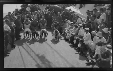 Image: Wheelbarrow race on deck of ship