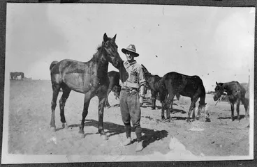 Image: Unidentified soldier and a horse named "Bones."