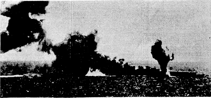 White smoJce rises near the bow of a badly-hatter ed Japanese aircraft-carrier as she was about to sink, after an attack by United States aircraft. At least a hundred planes and a crew of approximately two ihousatid went down, with her^ (Evening Post, 08 August 1942)