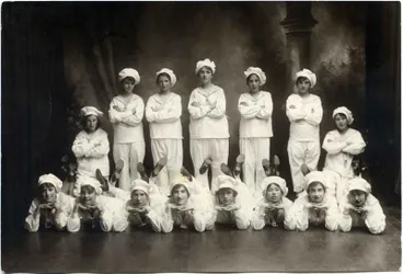 Image: Fifteen young women in sailor costume.