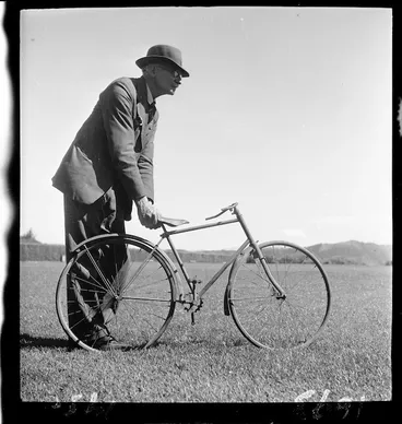 Image: Man with miniature cycle
