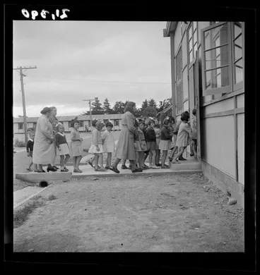 Image: Pani Petrus and a group of young girls enter a dining room at a Polish refugee camp, Pahiatua