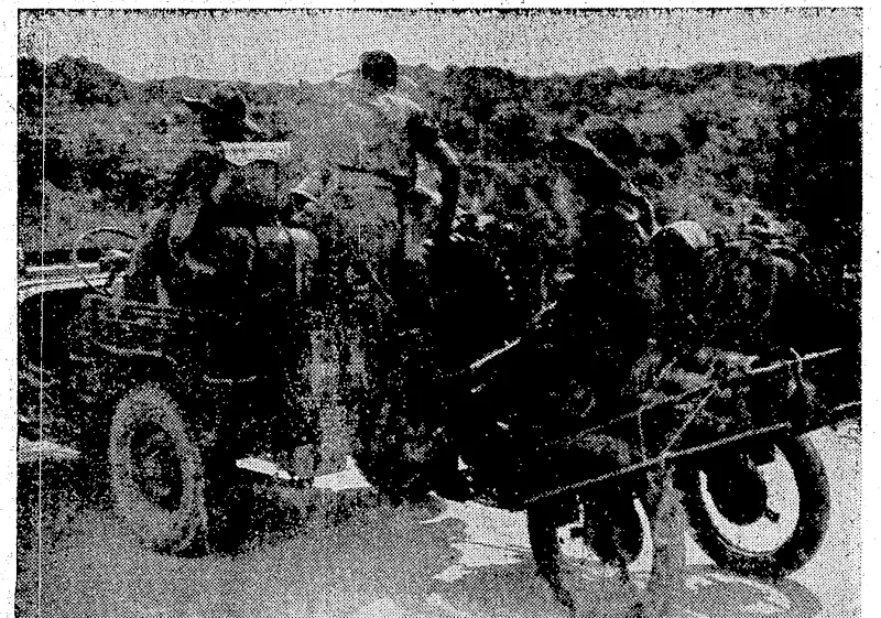 if/Troops ofthel6sth American Infantry; Brigade, formerly known as New York's "Fight-3^5 69th" landing on a beach at Makin Isl^ stages of the recovery in ':^^\':&:'^a9s^---ojN^-^:-!TAe*c''»ie»-are advancingmnder fire from Japanese;snipers* WmfraliaTps (^l 3arakaru .This ,/eep,, trailing d"jungle Iwndcarif" is loaded'to capacity Vv with, ammunition and signals equipment. .-,'-. (Evening Post, 15 August 1945)